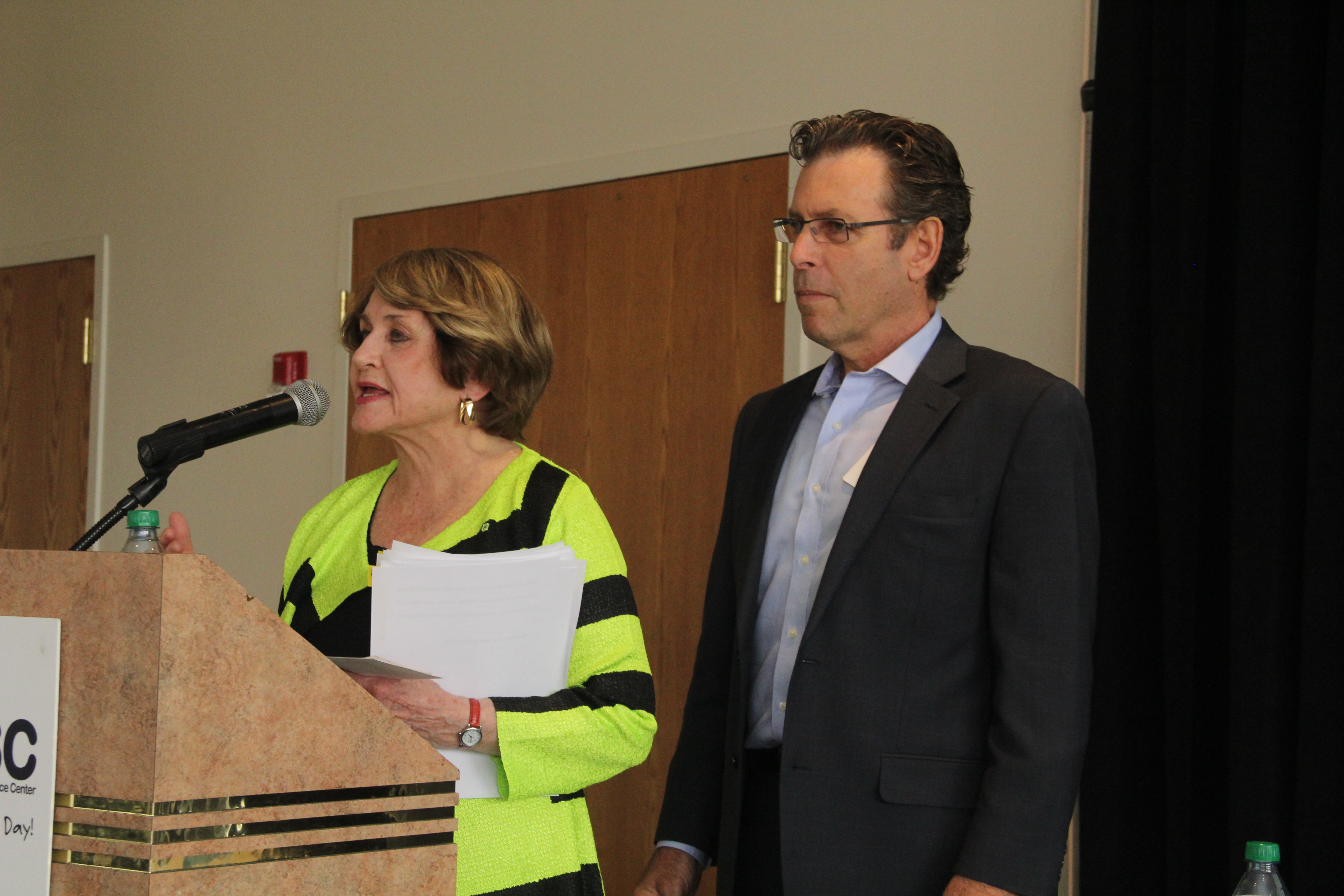 Congresswoman Louise Slaughter delivers opening remarks at RRPC's Annual Meeting Sept. 4 as RRPC Executive Director Tom Battley looks on.