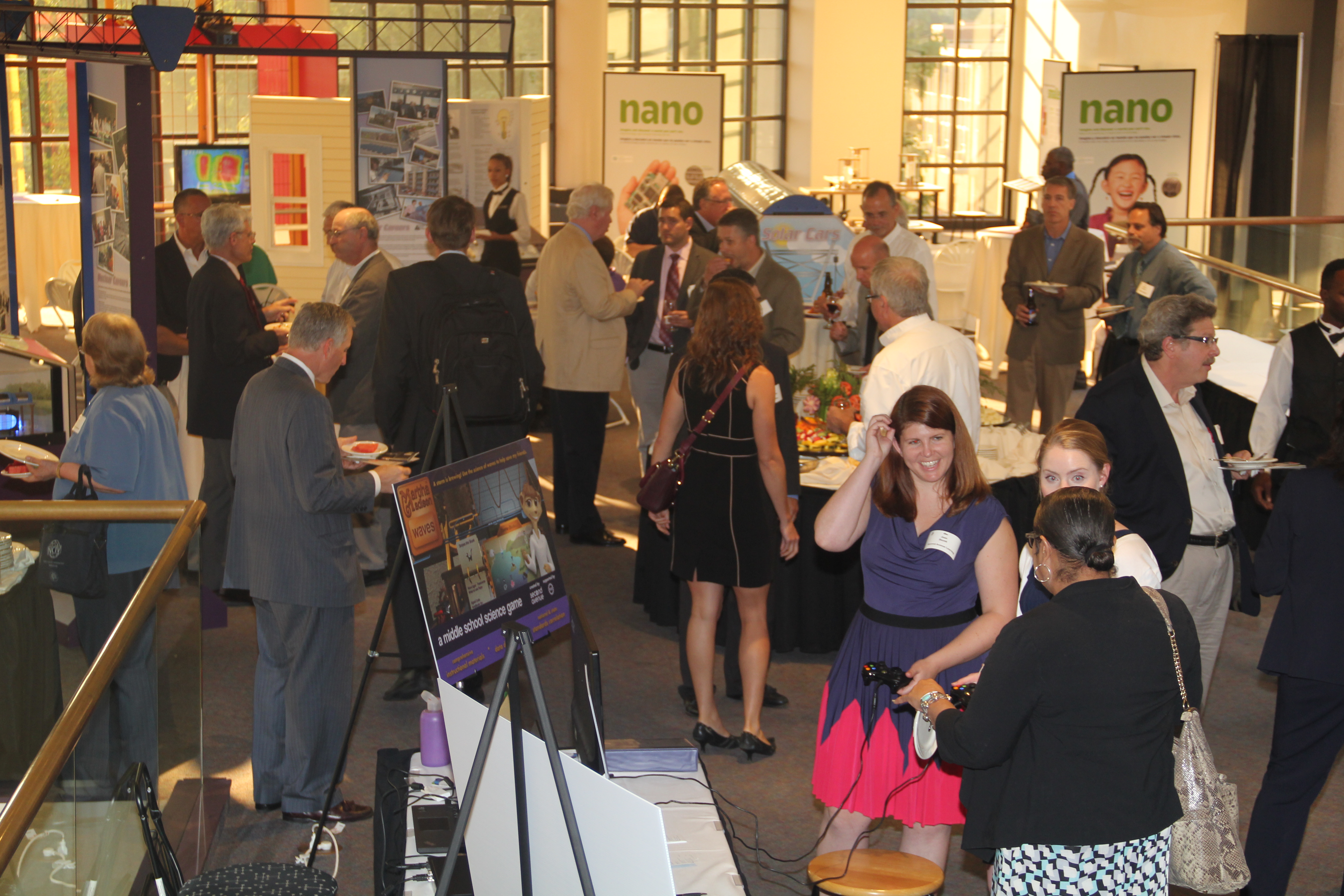 Attendees enjoy networking and refreshments after the meeting at the Rochester Museum and Science Center