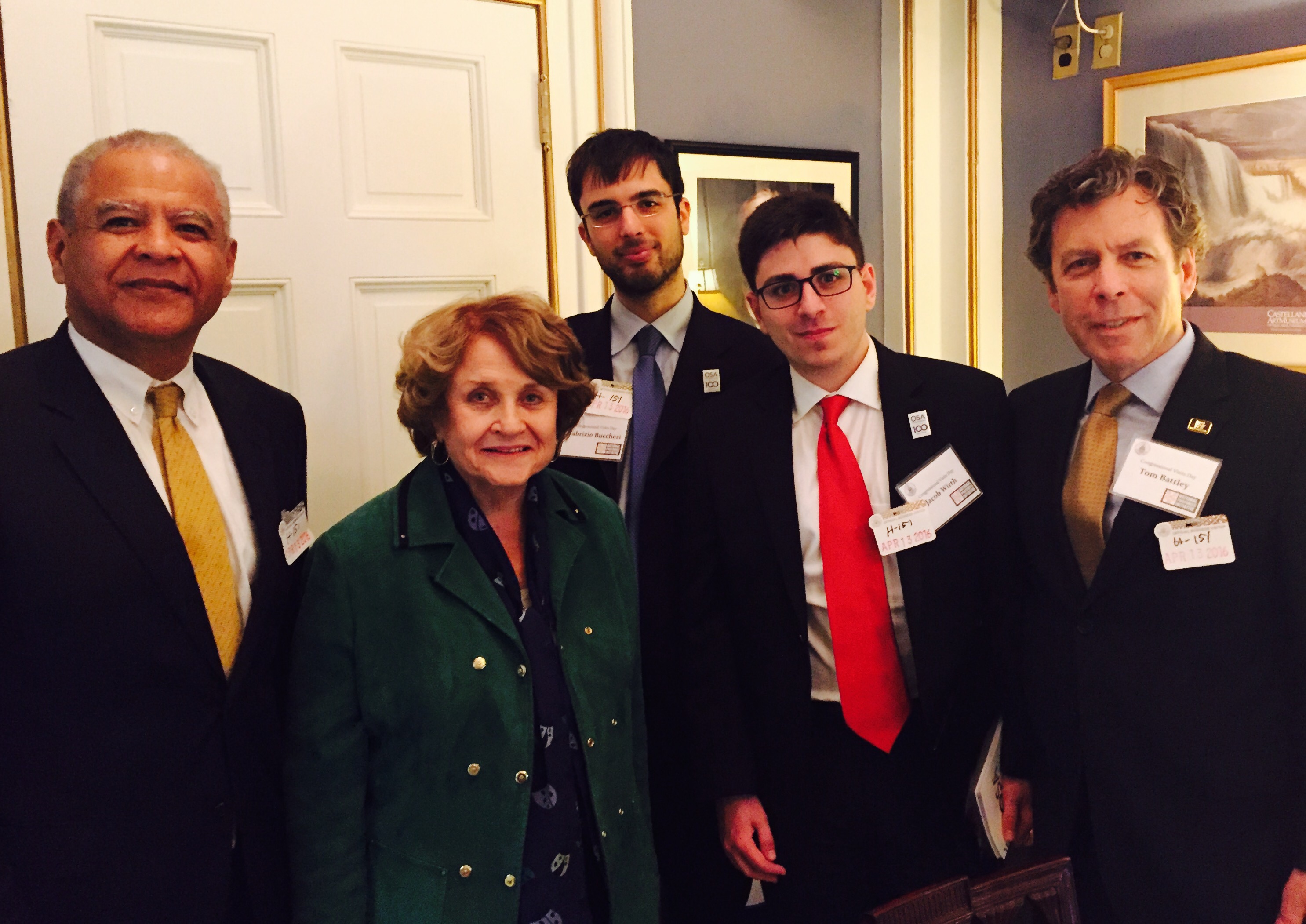 In Rochester Congresswoman Louise Slaughter's office. Left to right: AIM Photonics Executive, Ed White; Congresswoman Louise Slaughter (NY25); UR PhD candidate, Fabrizio Buccheri; RIT PhD candidate, Jacob Wirth; New York Photonics Executive Director, Tom Battley